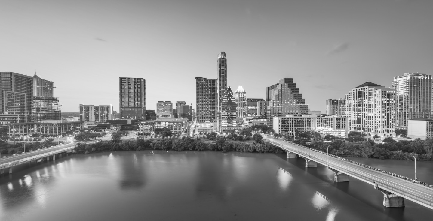 Night skyline of downtown Austin in black and white.