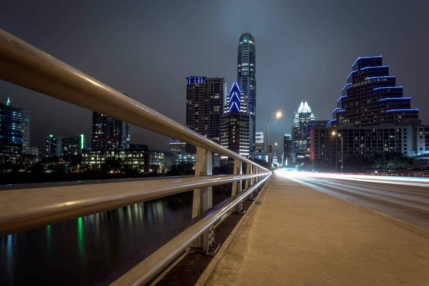 Downtown Austin from a pedestrian bridge at night.